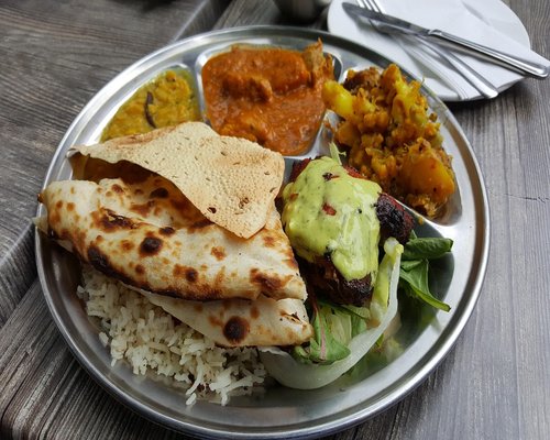 A traditional Indian thali with rice, dal, and roti