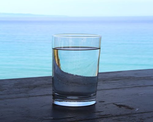 Glass of water on a wooden table